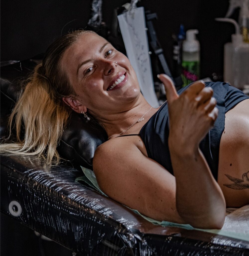 A Blonde Woman Gives a Thumbs Up